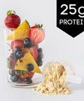 Ingredients for Pineapple Berry Protein Smoothie with pineapple chunks, strawberries, blueberries, banana slices, and a scoop of whey protein powder.