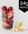 Ingredients for Vanilla Berry Protein Smoothie with strawberries, blueberries, and vanilla whey protein powder.