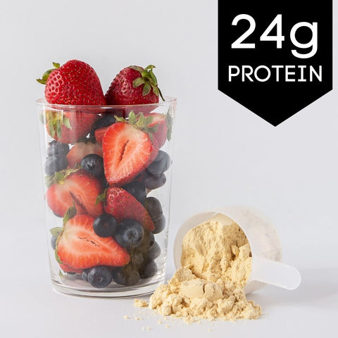 Ingredients for Vanilla Berry Protein Smoothie with strawberries, blueberries, and vanilla whey protein powder.